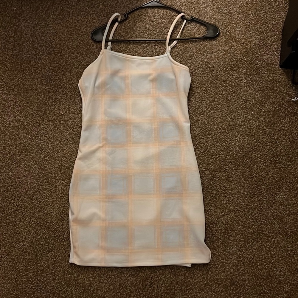 Cute dress but a little see through but not a lot!Brand:Riley and James Size:L